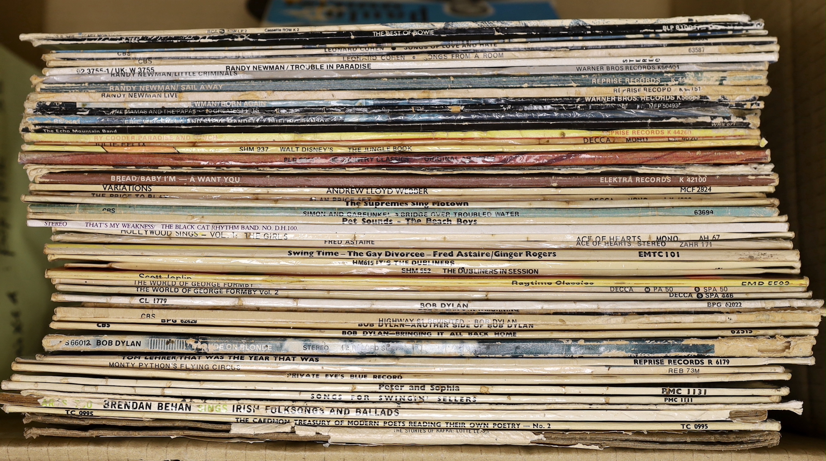 Fifty mainly 1970s LPs, including David Bowie, Leonard Cohen, Randy Newman, Bob Dylan, Simon & Garfunkel, and a number of comedy etc LPs, including Monty Python, Peter, Sellers, Private Eye, etc